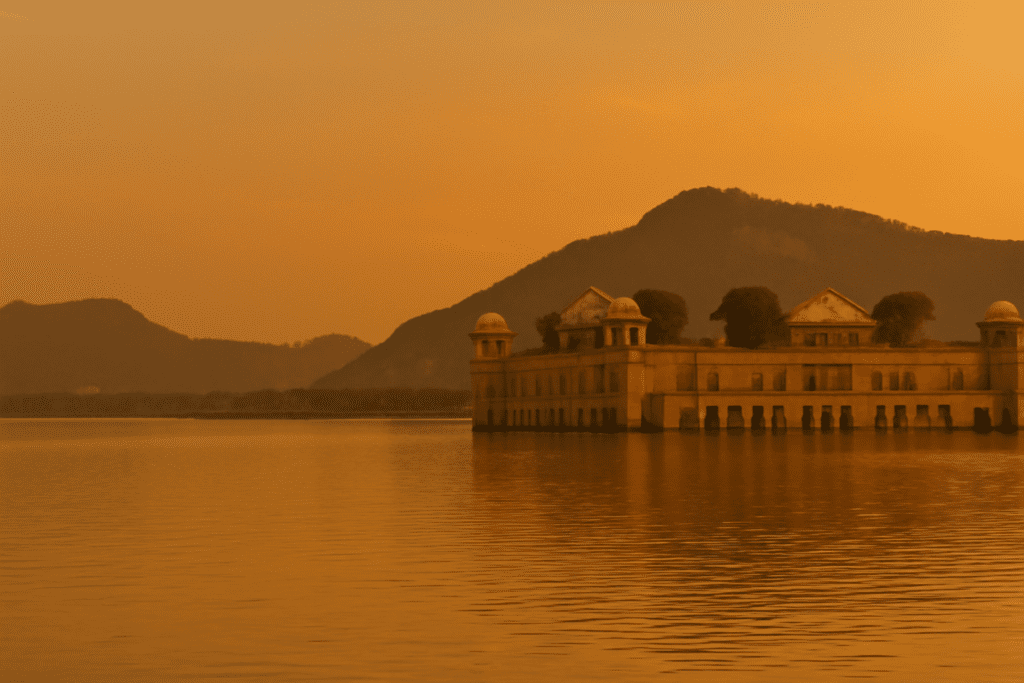 Sunset view of Jal Mahal with wedding photography tips overlay.
